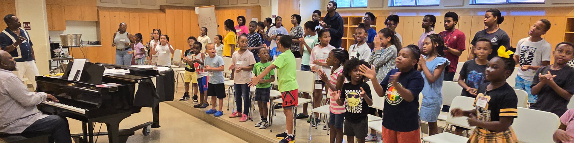 children and youth rehearsing songs in choir room